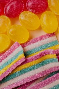 Kaboompics - Red and Yellow Jelly Candy with Rainbow Sour Belt Stripes, Close-Up