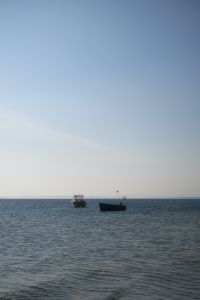 Kaboompics - Small Boats on Calm Sea Horizon