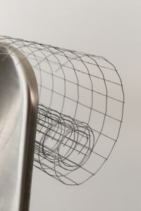 Kaboompics - Modern Wire Grid Cylinder and Metal Disc Background