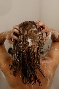Kaboompics - Woman Massaging Shampoo into Wet Hair