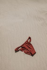 Kaboompics - Red Bikini Top on a Sandy Beach