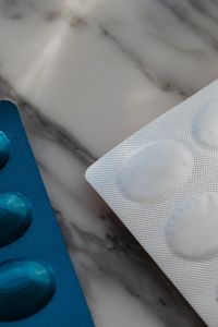 Kaboompics - Close-Up of Blue and White Medicine Blister Packs on Marble