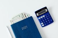 Kaboompics - Close-Up of 2021 Planner, Dollar Bills and Calculator