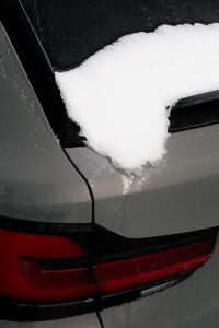 Kaboompics - Black Car Window Trim Covered with Snow and Water Drops