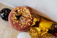Kaboompics - Overhead New Year's Eve Table With Champagne, Gold Confetti And Balloons