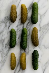 Kaboompics - Fresh Cucumbers and Pickles in a Minimal Marble Flat Lay