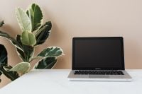 Kaboompics - Minimal Laptop on Marble Desk with Green Plant and Copy Space