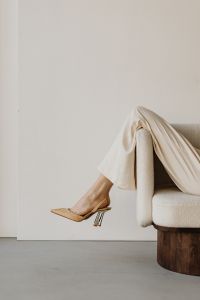 Kaboompics - Minimalist Shoe Styling with Beige Heels on a Modern Sofa