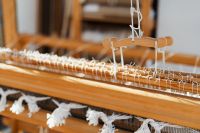 Kaboompics - Wooden Loom Frame with Hanging White Threads