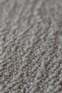 Kaboompics - Macro View of Light Beige Bouclé Upholstery Fabric Fibers