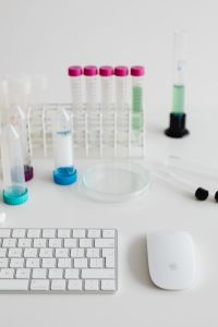 Kaboompics - Sample Tubes and Laboratory Rack Beside Keyboard