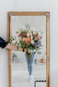 Mixed Flower Bouquet Portraits with a Man, Ornate Mirror and Black Pistol