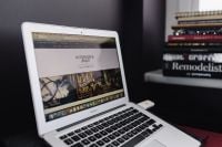 Kaboompics - MacBook on Pink Desk with Interior Design Books