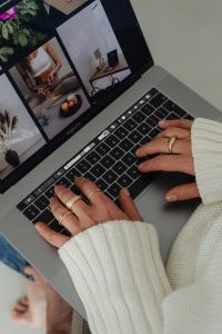 Kaboompics - Close-Up of Hands Typing on Laptop