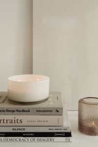 Kaboompics - White Ceramic Vessel and Textured Glass Votive on Interior Design Books