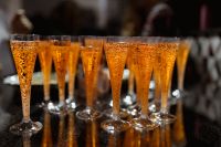 Kaboompics - Aperol Spritz in Champagne Flutes on a Dark Table