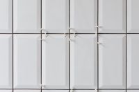 Kaboompics - Laying white ceramic tiles in the bathroom