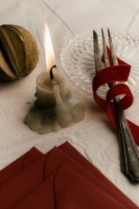 Kaboompics - Festive Table Setting with Candle and Red Ribbon