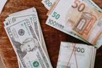 Kaboompics - Polish Zloty, US Dollar and Euro Banknotes on Dark Wood, Mixed Currency Flat Lay