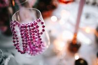 Kaboompics - Pink Beaded Garland on Glass with Festive Bokeh Background