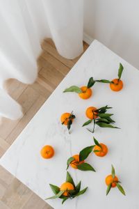 Kaboompics - Fresh Mandarins with Green Leaves on a Bright Marble Table for Winter Recipe Covers