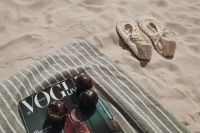 Kaboompics - VOGUE Magazine, Sunglasses and Beach Accessories on a Towel
