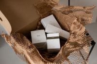 Kaboompics - Unboxing Skincare Essentials in Natural Packaging