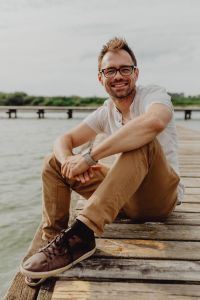 Lakeside Men's Lifestyle Photography: Retro Calculator Watch, Eyeglasses and Smartphone by the Water