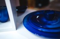 Kaboompics - Blue Ceramic Plates and Serving Dish in Display Cabinet