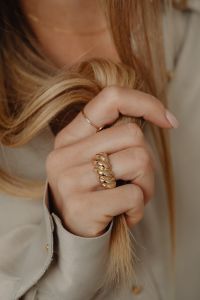Kaboompics - Woman Holding Her Hair Wearing Gold Ring
