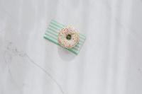 Kaboompics - Donuts on paper napkins placed on white marble