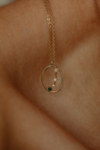 Kaboompics - Gold Oval Pendant Necklace Close-Up on Skin