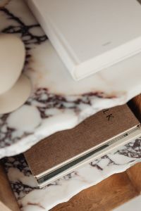 Kaboompics - Soft Focus of a White Design Book and Ceramic Decor on Marble