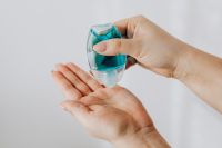 Kaboompics - Person Squeezing Blue Hand Sanitizer into Open Palm