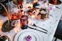 Kaboompics - Rose Wine Glass and Gift on an Elegant Christmas Table