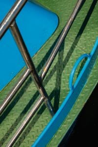 Kaboompics - Blue Boat Deck With Metal Railings and Shadow Pattern