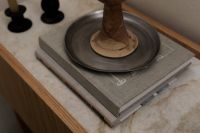 Kaboompics - Close-Up Japandi Decor with Sculptural Vase on Books and Tray