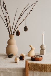 Kaboompics - Neutral Easter Table With Hanging Egg Ornaments And Candle