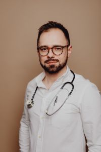Kaboompics - Front-Facing Doctor Portrait with Glasses and Stethoscope for Medical Practice Websites