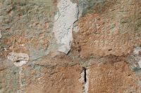 Kaboompics - Weathered Orange Stone and Plaster Wall