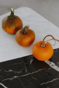 Kaboompics - Orange halloween pumpkins on marble