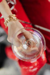 Kaboompics - Seated New Year Toast with Champagne above Red Trousers