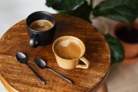 Kaboompics - Overhead Coffee Still Life with Two Ceramic Cups and Black Spoons