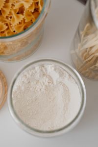 Kaboompics - Close Crop of Farfalle and Spaghetti Stored in Clear Glass Jars