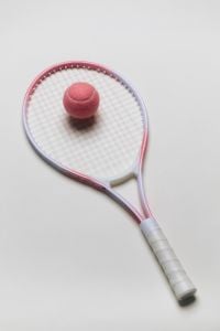 Kaboompics - Pink Tennis Ball on a Tennis Racket