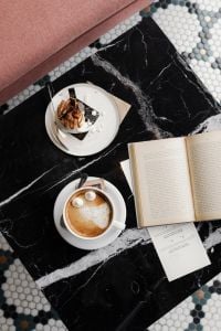 Kaboompics - Coffee Break in a Cafe with a Book and Dessert