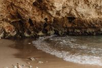 Kaboompics - Rocky Cove With Small Wave Breaking On Shore