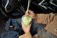 Kaboompics - Close Up of Iced Matcha Being Stirred in a Car