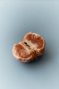 Kaboompics - Grapefruit Close Up on Blue Background