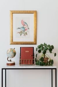 Kaboompics - 2020 Planner and Globe on a White Marble Console